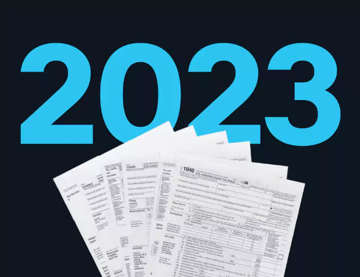 tax documents over '2023' text